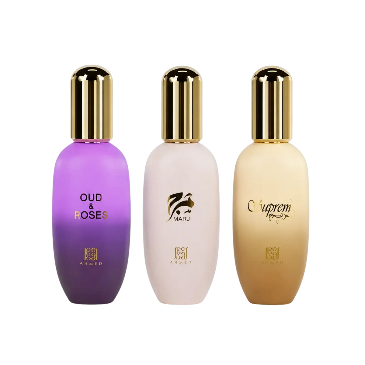 Three perfume bottles from the brand Ahmed Al Maghiribi, shown side-by-side on a solid white background. The left bottle is purple with gold lettering reading 'OUD & ROSES' and has a gold cap, Marj, and Supreme body gel at Elmeira India