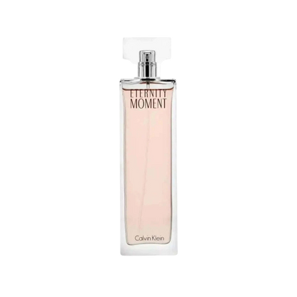 Calvin Klein Eternity Moment Eau de Toilette perfume bottle with a rectangular glass body, light pink liquid, and a clear cap, shown on a plain white background.