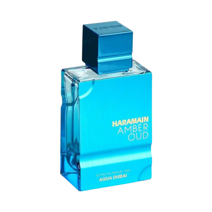 A rectangular glass perfume bottle with a metallic blue cap, labeled 'HARAMAIN AMBER OUD' and 'AQUA DUBAI', on a plain white background.