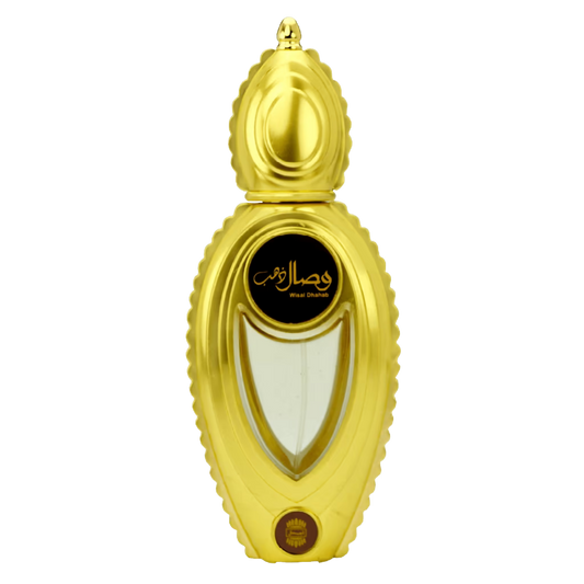 A gold-colored perfume bottle with a sculpted, ribbed cap and body, featuring a black oval label with gold Arabic calligraphy and the text 'Ajmal Wisal Dhahab '. The bottle is centered on a plain white background.