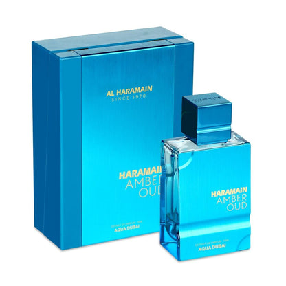 Al Haramain Amber Oud Eau de Parfum bottle and its matching metallic blue packaging box, displayed on a clean white background.