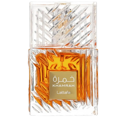 A clear glass perfume bottle with a faceted, geometric transparent cap and a gold label reading 'Khamrah Lattafa' in white text. The bottle is filled with amber-orange liquid and photographed on a plain white background.