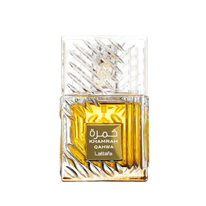 A rectangular glass perfume bottle with a faceted, textured clear cap and base, filled with rich amber-yellow liquid. A gold label on the front reads 'KHAMRAH QAHWA Lattafa' in white text. At elmeira India