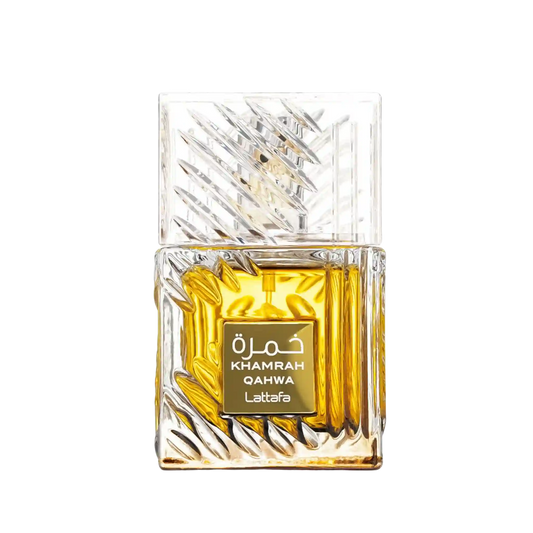 A rectangular glass perfume bottle with a faceted, textured clear cap and base, filled with rich amber-yellow liquid. A gold label on the front reads 'KHAMRAH QAHWA Lattafa' in white text.