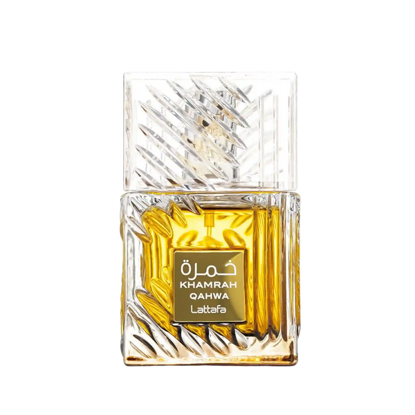 A rectangular glass perfume bottle with a faceted, textured clear cap and base, filled with rich amber-yellow liquid. A gold label on the front reads 'KHAMRAH QAHWA Lattafa' in white text.