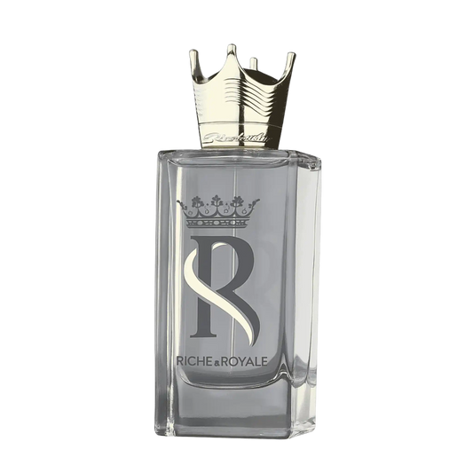 A rectangular clear glass perfume bottle with a metallic gold crown cap, featuring a large silver 'R' logo and the brand name 'Riche & Royale' on the front, set against a plain white background.