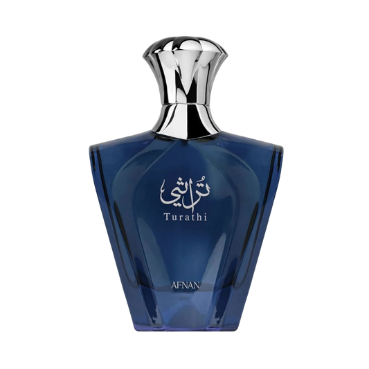 A bottle of Arnott Turathi perfume, featuring a faceted dark blue glass body with a shiny silver metallic cap, set against a plain white background.