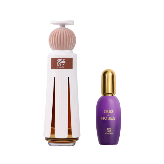 A white and pink diffuser bottle with amber liquid and a smaller purple bottle with a gold cap, both labeled Oud and Roses and marj perfume