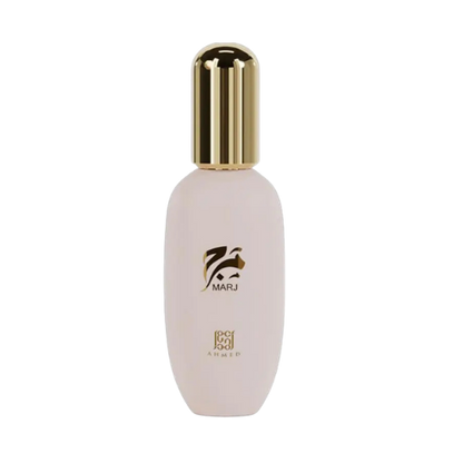A pale pink cosmetic bottle with a shiny gold cap, featuring the brand name MARJ and 'porcelain amber' printed on the front, set against a plain white background.