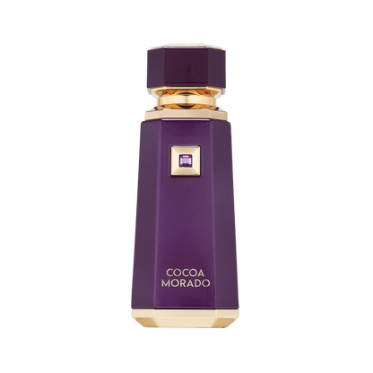 A faceted purple bottle of Cocoa Morado perfume with gold trim and a small purple crystal accent, centered on a plain white background.