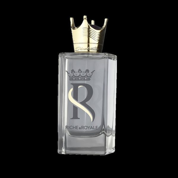 A rectangular clear glass perfume bottle with a metallic gold crown cap, featuring a large silver 'R' logo and the brand name 'RICHE-ROYALE' by fragrance world on the front, set against a solid black background.