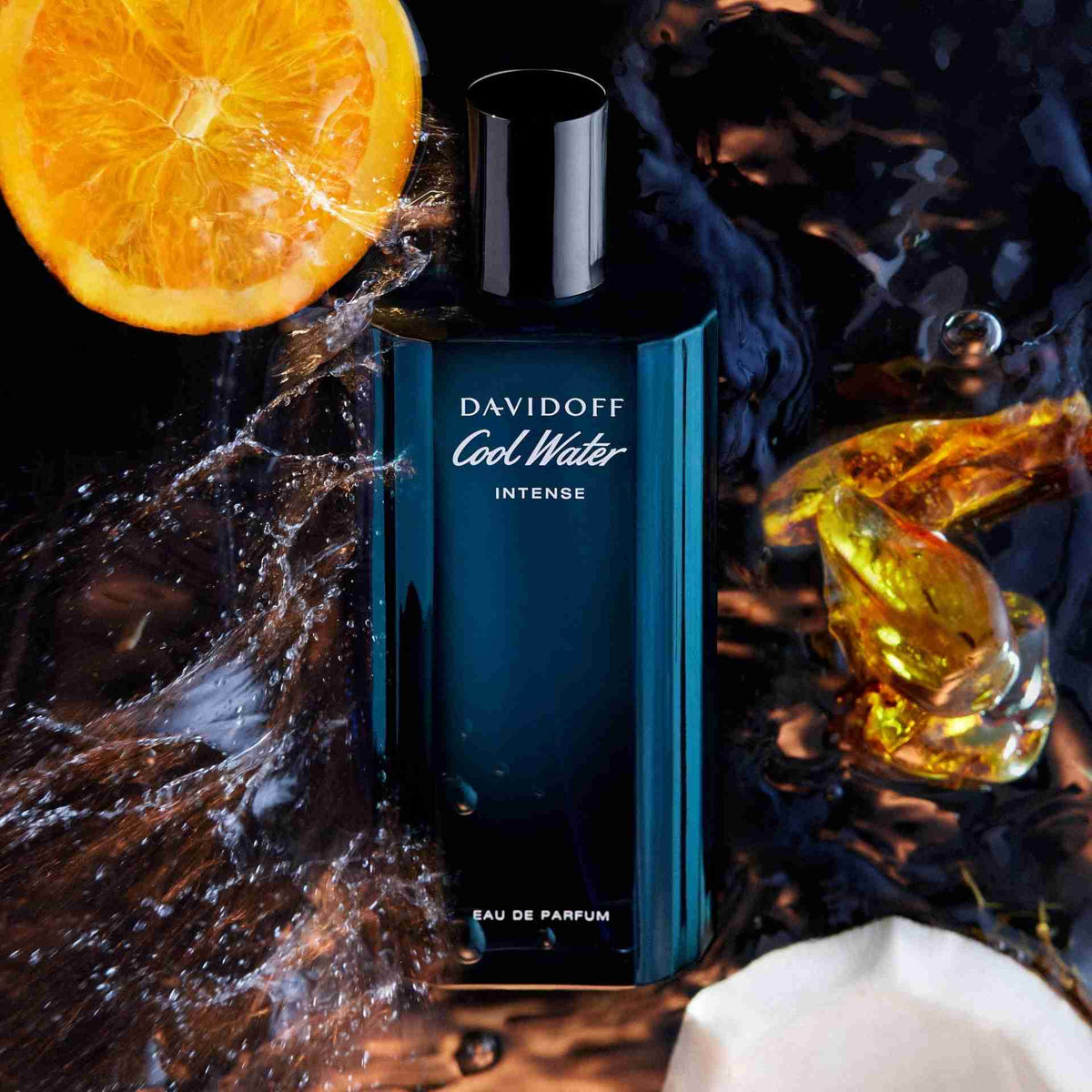 Davidoff Cool Water Intense perfume bottle with an orange and water splash on a dark background