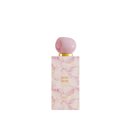 Perfume bottle with pink floral design and 'Rose Noir' text on a white background